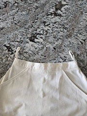 WOMEN’S WHITE TENNIS SKIRT WITH BLUE, PINK, AND PURPLE TRIM IN SIZE 7/8
