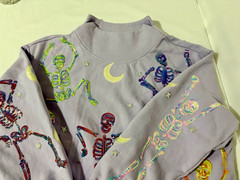 QUEEN OF SPARKLES LAVENDER MULTI DANCING SKELETON MOCK NECK SWEATSHIRT MEDIUM