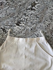 WOMEN’S WHITE TENNIS SKIRT WITH BLUE, PINK, AND PURPLE TRIM IN SIZE 7/8