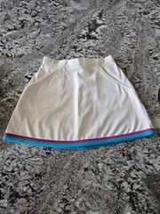 WOMEN’S WHITE TENNIS SKIRT WITH BLUE, PINK, AND PURPLE TRIM IN SIZE 7/8